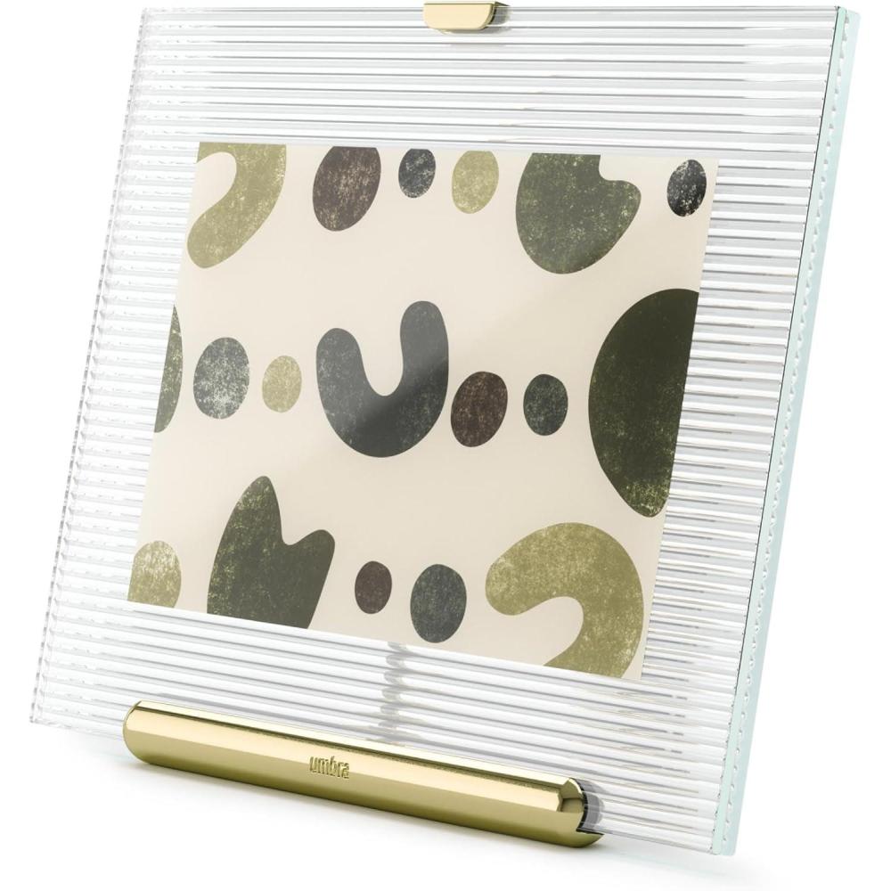 image:imageUmbra Flute 5x7 Floating Picture Frame Modern Glass Photo Frame with Ribbed Backing and Integrated Easel Tabletop Display for Photos or Artwork ChromeBrass